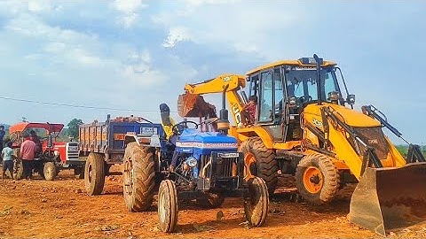 Jcb 3dx plus eco xpert Mud in powertrack 439 Mahindra 575 massey tractor trolley loading JCB video
