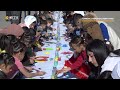 Children in Syria’s Qamishli make large painting to support kids with cancer