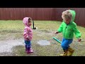 Rain rain go away! Drix and Emy splash in the puddles