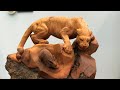 Carvings leopard hunt rabbits | TUAN WOOD CARVINGS