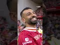 Mo Salah celebrates with the title in front of the Kop!