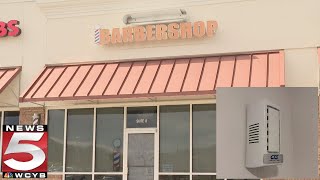 Police investigating after employee claims hidden camera found inside barber shop