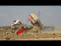 Apparently Dump Truck Unloading Rock Overturn &amp; Recovery By Excavator, Wheel Loader
