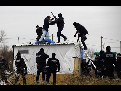 Couple removed from top of shelter by riot police