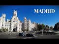 Madrid bus tour  sunny day drive on gran va madrid river atocha  spain  4k 60fpsr