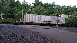 UNION RR coming across with a string of covered coil cars.