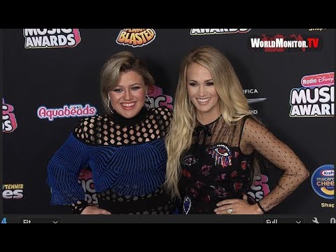 Carrie Underwood & Kelly Clarkson United On The Radio Disney Music Awards Red Carpet  PHOTOS