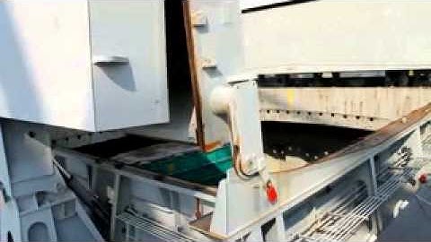 LOADING WOODCHIP ON BOARD BY USING STS CRANE AND 40F DUMPING CONTAINER