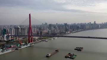 SHANGHAI,Yangpu District, Aerial shot over Huangpu River with Yangpu Bridge and Shanghai skyline