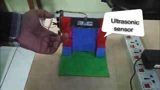 AUTOMATIC DOOR WITH ULTASONIC SENSOR AND SERVO MOTOR