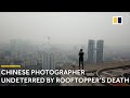 Chinese photographer undeterred by rooftoppers death