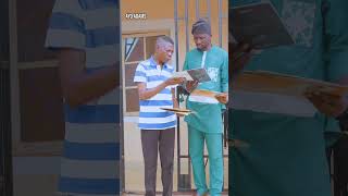 Micho Ade showing me his album covers, including the album that contains his hit track, Ogun Laye.