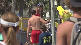 Jax Beach lifeguards revive man after drowning as search for missing swimmer continues