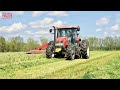 Case IH MAXXUM 140 Tractor Mowing Hay