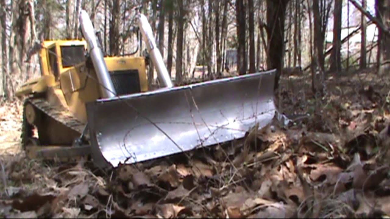 RC Dozer pushing out stumps with KG blade YouTube