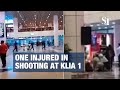 Malaysia shots fired at kuala lumpur airport one injured