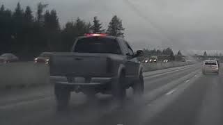 Guy almost gets hit running across I-5 in traffic