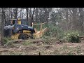Mulching a pile of Oak trees with a John Deere 333g Skid Steer