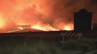 Fire crews in California working to gain ground on wind-driven wildfire