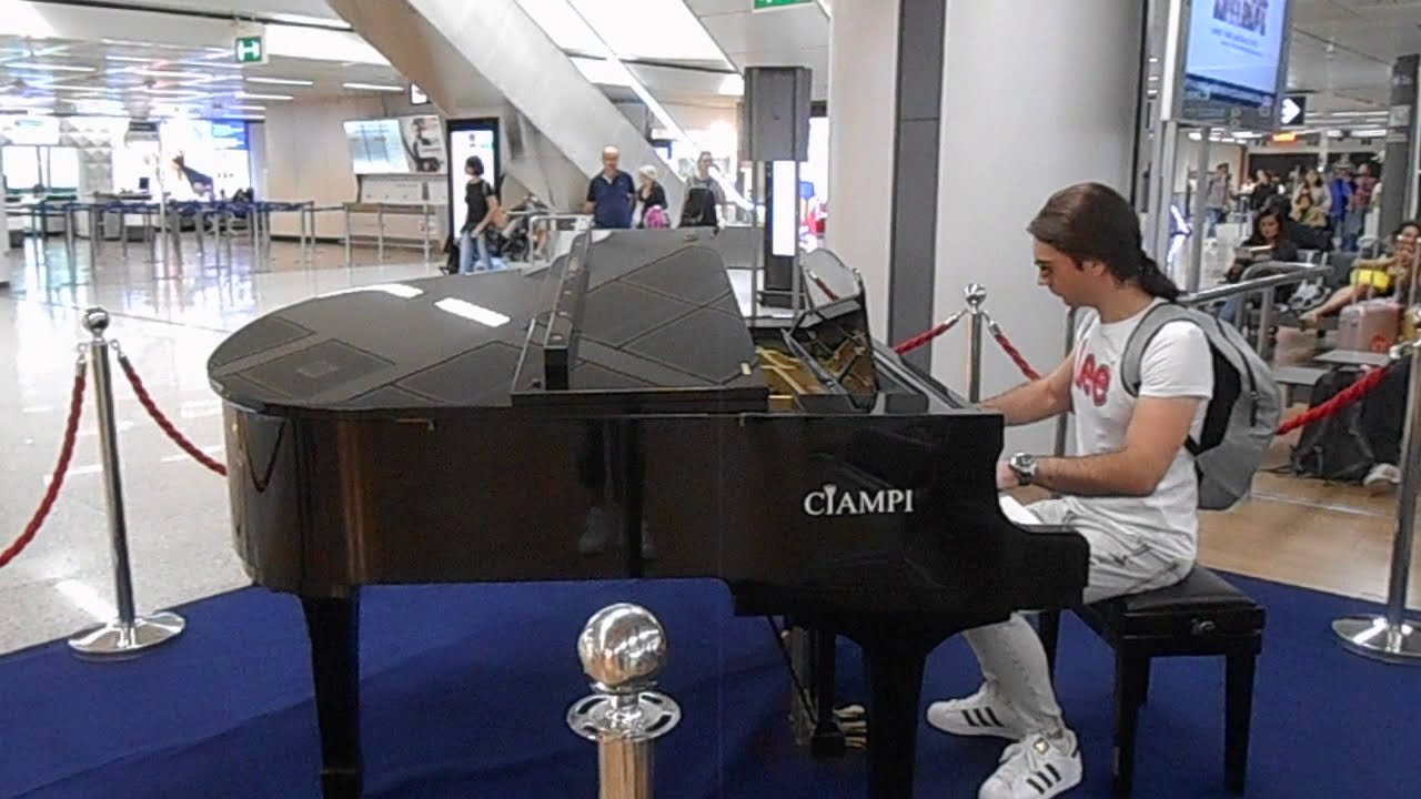 Playing piano at Fiumicino airport in Italy YouTube