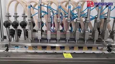 AUTOMATIC LIQUID FILLING LINE WITH PUCKS & AUTO DEPUCKING
