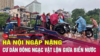 Ngập khắp nơi, người dân Hà Nội thuê xe ba gác vượt‘biển nước’với 200.000 đồng cho một chuyến.Tin24h