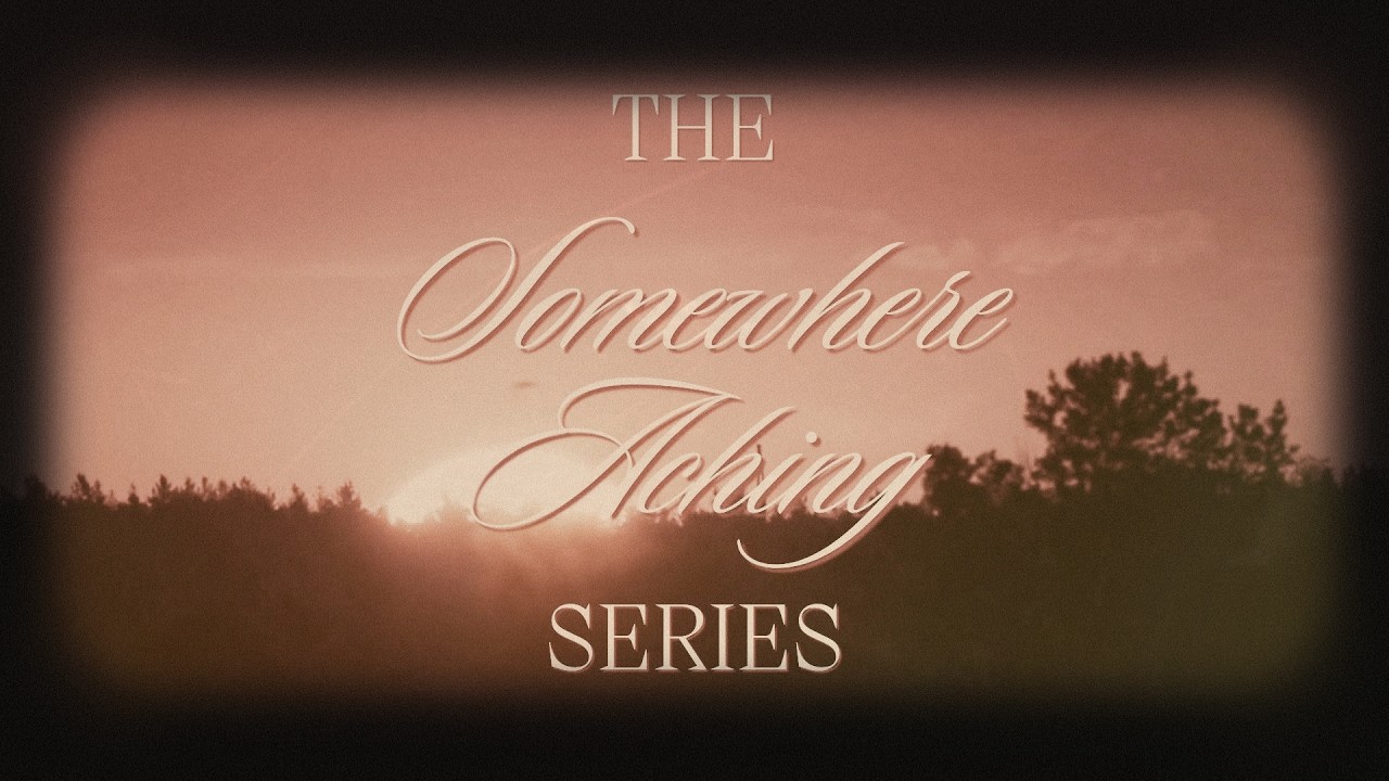 A sunrise with The Somewhere Aching Series written in scrolling script