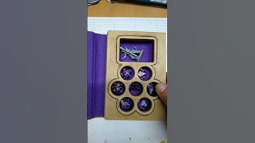 D&D dice box, with room for a set of 7 dice and a miniature.