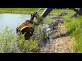 John Deere Back Hoe Pond Stump Clearing