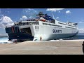 Double arrival of ships in the port of tinos sea jet and blue star ferries