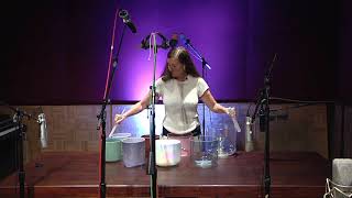 SOUND HEALING: Lorelei plays alchemy crystal singing bowls in a studio session.