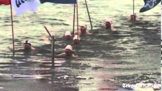 Russian Ice Swimming Team Take The Olympic Torch For A Swim In Icy River