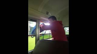 Savage Kid Throws Book Bag Out Window Of Bus