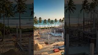 This video showcases the construction process of a luxury beachfront villa with stunning ocean views