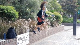 AC/DC - Kicked In The Teeth By Angus Young Street Performer!