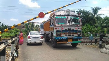 Gateman in Trouble Loaded Trucks Crossing Railgate : High Speed train Come furiously