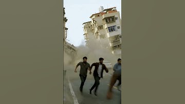 Massive Building Collapses into River – floodwaters on streets#BuildingCollapse
