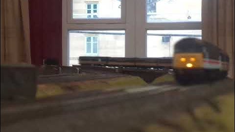 The BACHMANN is, BR Class 47 InterCity Swallow No.47828 was running on OO Gauge Layout. (V8/END)