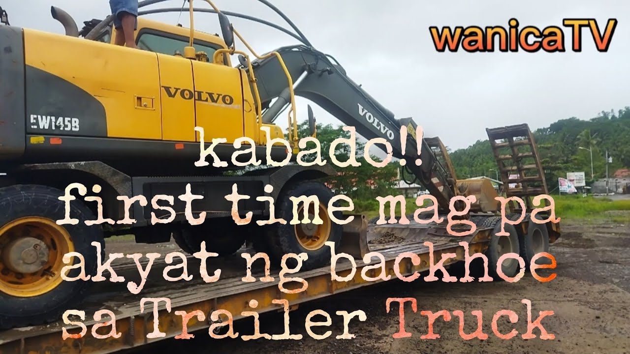 Loading and Unloading Volvo Wheel Excavator Into Trailer