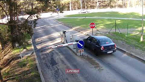 Man walking breaks toll booth gate arm