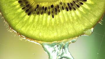 Super Slow Motion Macro Shot of Flowing Water from Kiwi Slice at 1000fps.