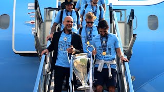 European Champions Manchester City arrive back in UK with Champions League trophy