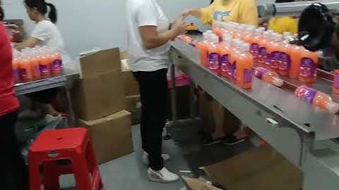 Shampoo bottle bucket film wrapping shrinking seaing packing machine