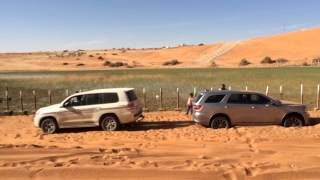 Dodge Durango rescued by Land Cruiser