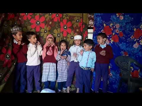 children of Madina Academy reciting Poems  together with action
