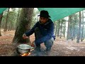 Heavy rain shelter and cooking in forest