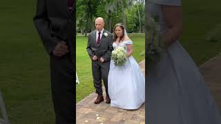 Master Deputy Hal Davis walks daughter down the aisle