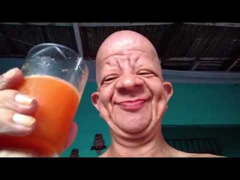 Old man drinks orange juice