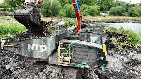 Excavators loading PRINOTH PANTHER T14R rotating tracked dumpers