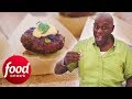 Ainsley Cooks Mouthwatering Lamb Patties In Chargrilled Cassava | Ainsley's Market Menu